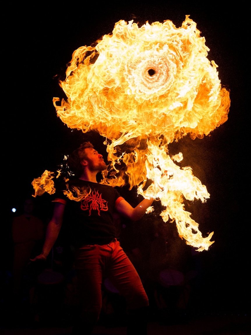 Luminous Botanicus fire thrower, part of the Enlighten festival in Canberra.