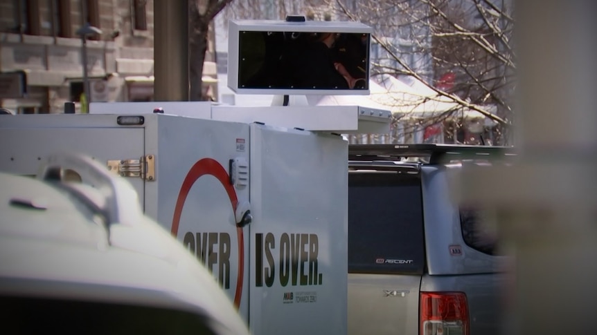 Obscured view of a mobile speed camera trailer.