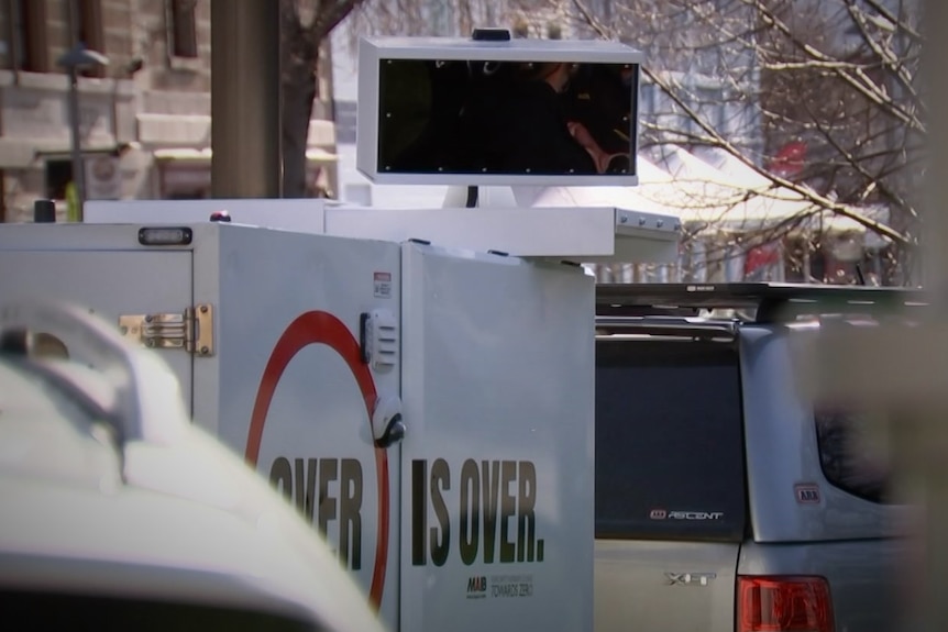 Obscured view of a mobile speed camera trailer.