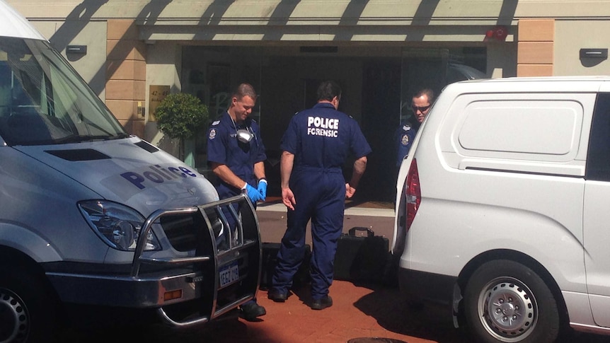 Outside the Jolimont nursing home where a couple was found dead, forensic police gather