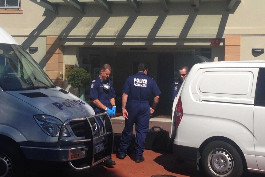 Outside the Jolimont nursing home where a couple was found dead, forensic police gather