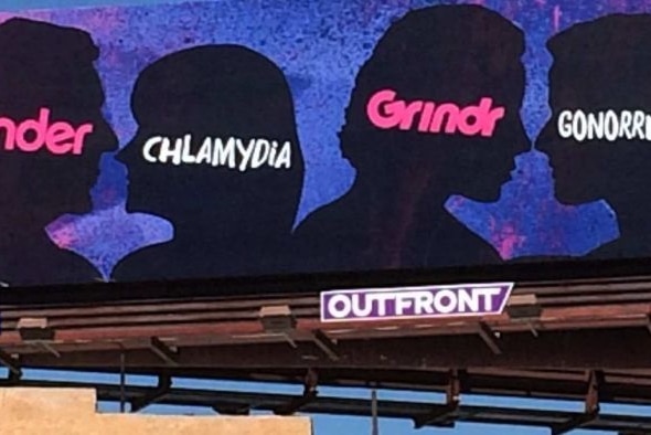 A close up photo of a billboard saying Tinder, Grindr and STI's are connected.