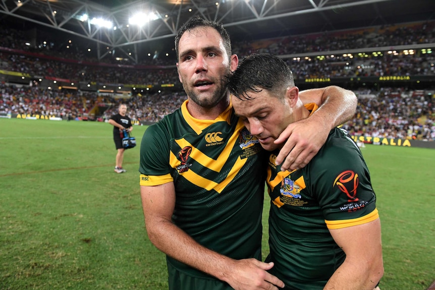 Cameron Smith embraces Cooper Cronk after Rugby League World Cup final.
