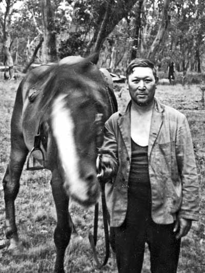 Thomas William (Bill) Ah Chow at Nunniong, with a horse.