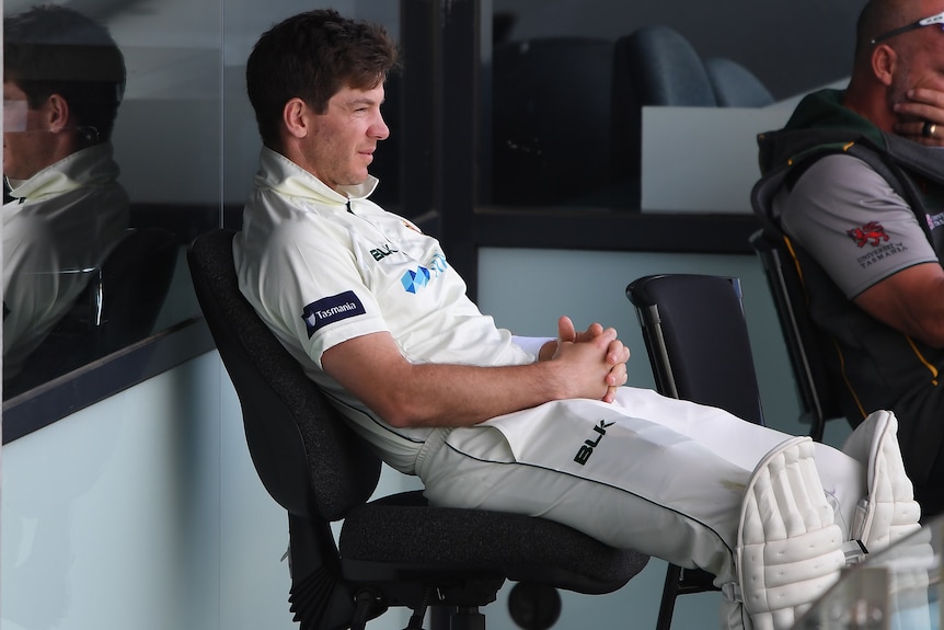 Tim Paine sits on a chair