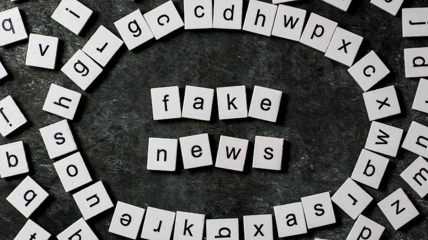 Scrabble pieces spelling "fake news"