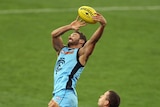 Andrew Walker leaps high on his way to a career-best six goals.