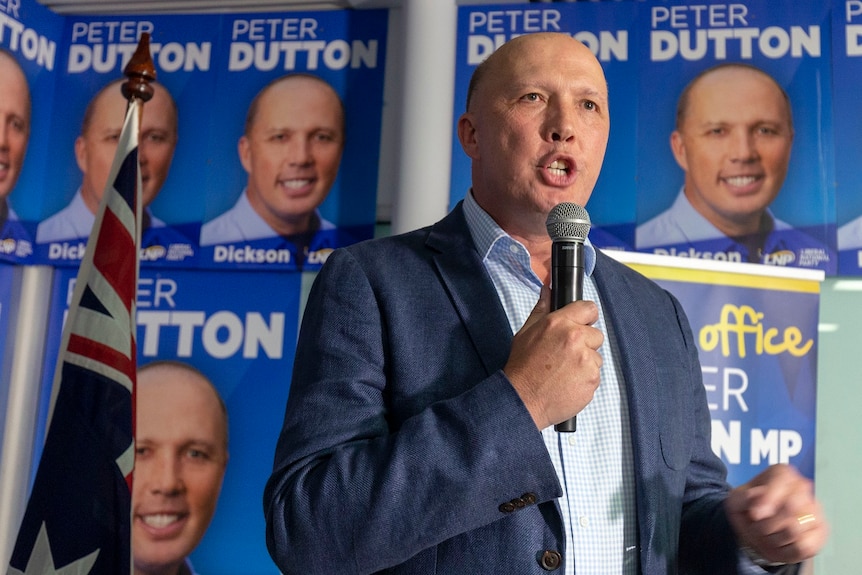 Peter Dutton speaks into a microphone while thanking supporters after his 2019 federal election victory. 