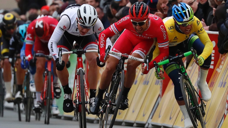 France's Nacer Bouhanni (2R) swerves into Michael Matthews (R) near Paris-Nice stage finish.