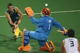 Grant Schubert takes a shot against Guus Vogels during their men's pool MB hockey match