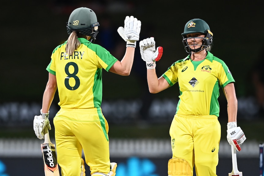 Ellyse Perry and Ashleigh Gardner celebrate an Australian win