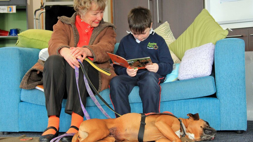 Jacqui Brown with student Logan and Lollipop the dog