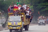 Supporters of Francisco Guterres drive through Dili.