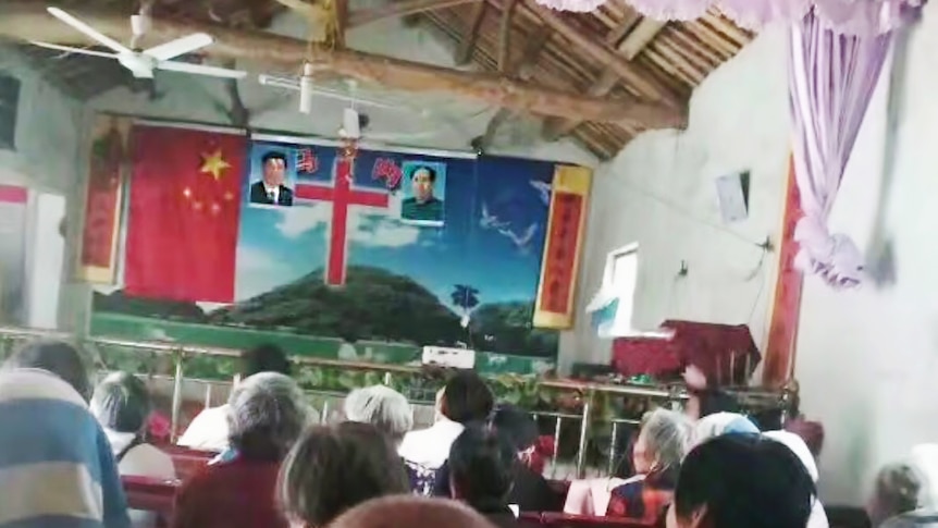 Photos of Xi Jinping and Mao Zedong flank a cross inside a church in China.