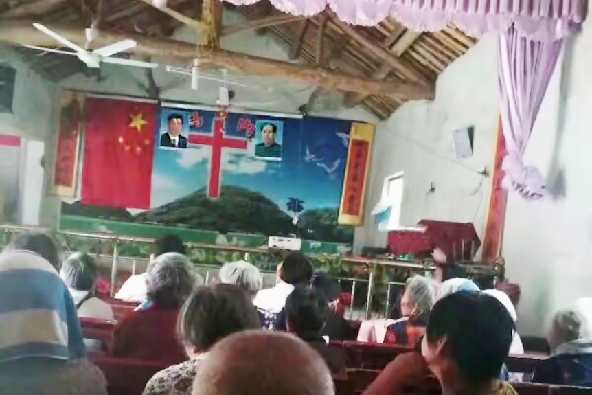 Photos of Xi Jinping and Mao Zedong flank a cross inside a church in China.