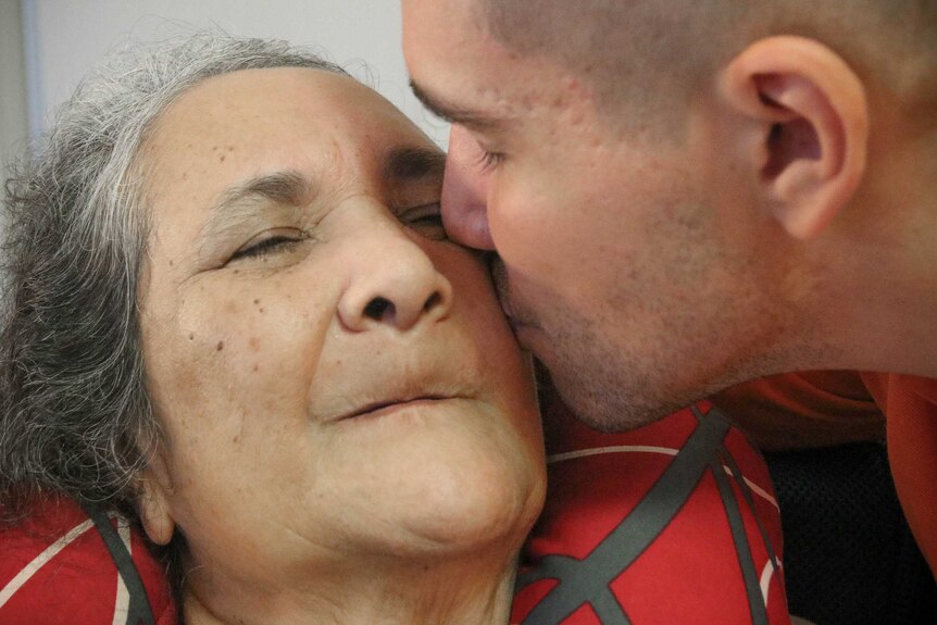 Man kisses his mother