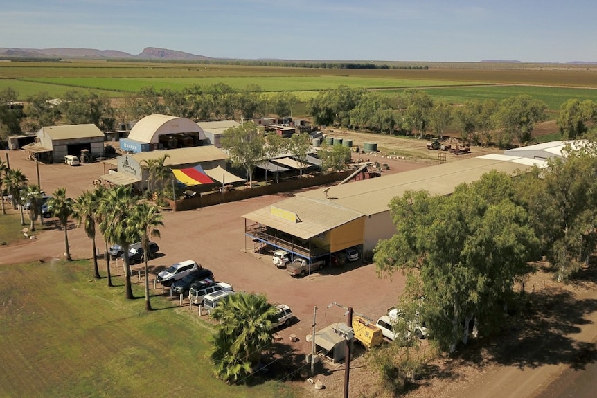 An aerial photo of a distillery surrounded by farm land.