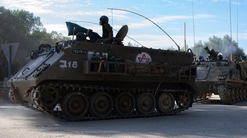 soldiers in tanks, front tank has star of david on it