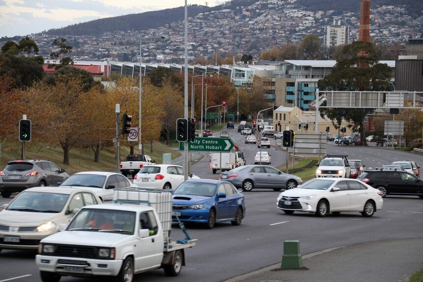 Traffic banks up on the outskirts of Hobart's CBD, the city is in the background.