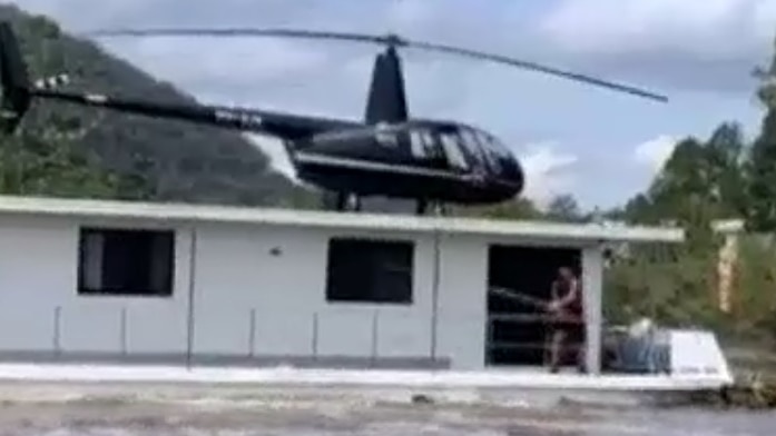 A helicopter on top of a boat