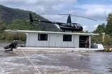 A helicopter on top of a boat