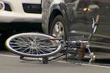 Bicycle on its side on the road after the fatal car-dooring on Sydney Rd Brunswick