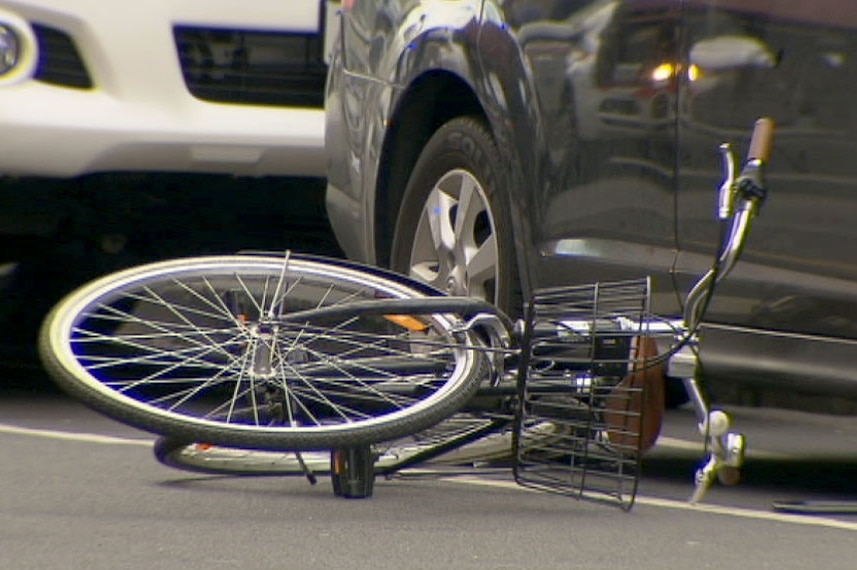 Bicycle on its side on the road after the fatal car-dooring on Sydney Rd Brunswick