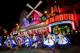 Dancers perform outside Moulin Rouge 