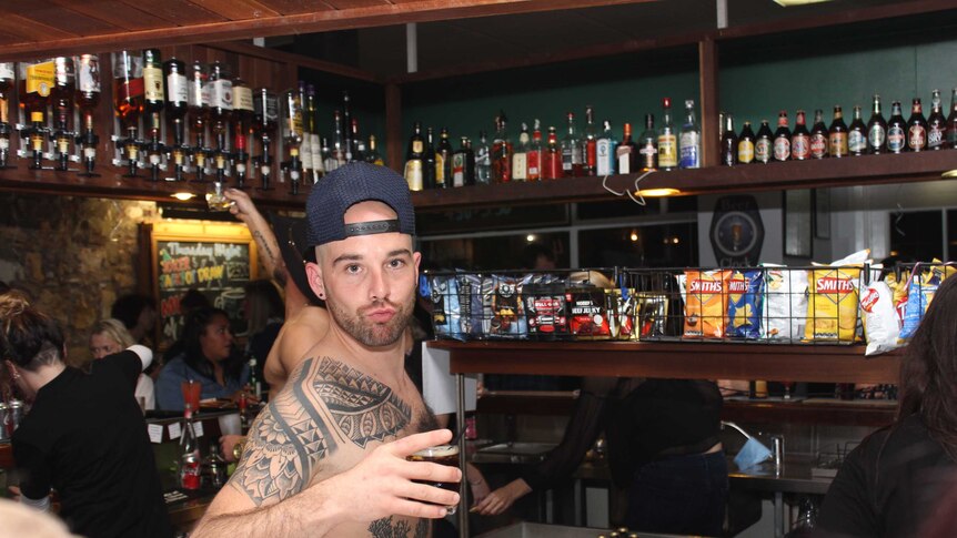 Male skimpy bartender in Kalgoorlie pub.