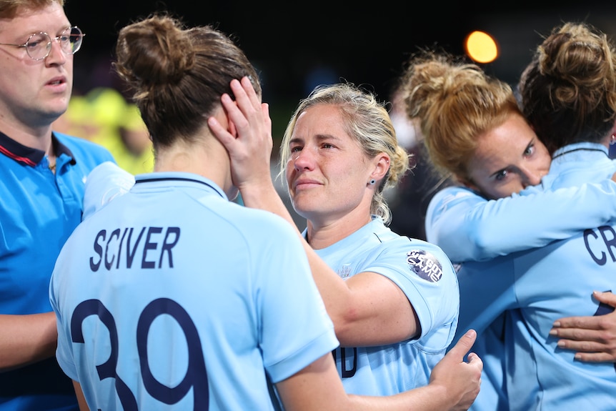 England player Katherine Brunt consoles partner and teammate Nat Sciver after the women's Cricket World Cup.