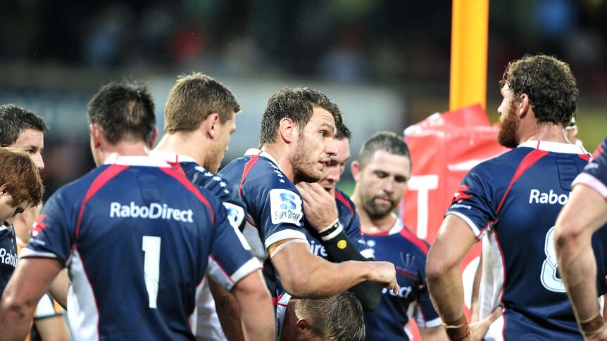 Stern chat ... Rebels centre Luke Inman (C) lays down to the law to his team-mates