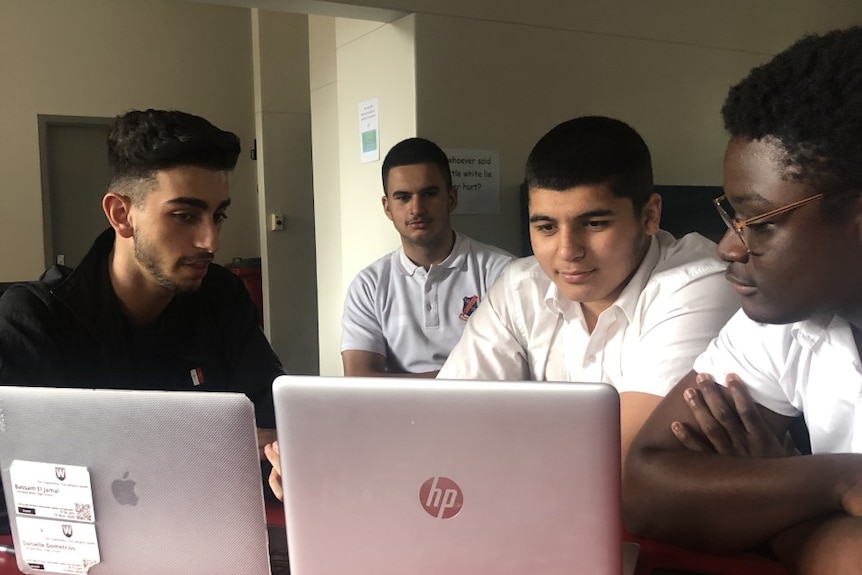 Students at a laptop 