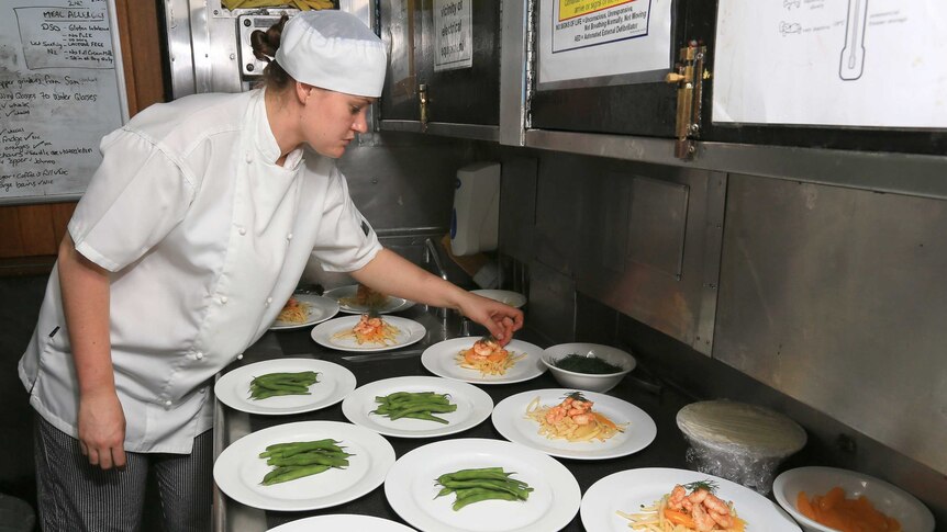 Chef prepares meal aboard HMAS Sydney