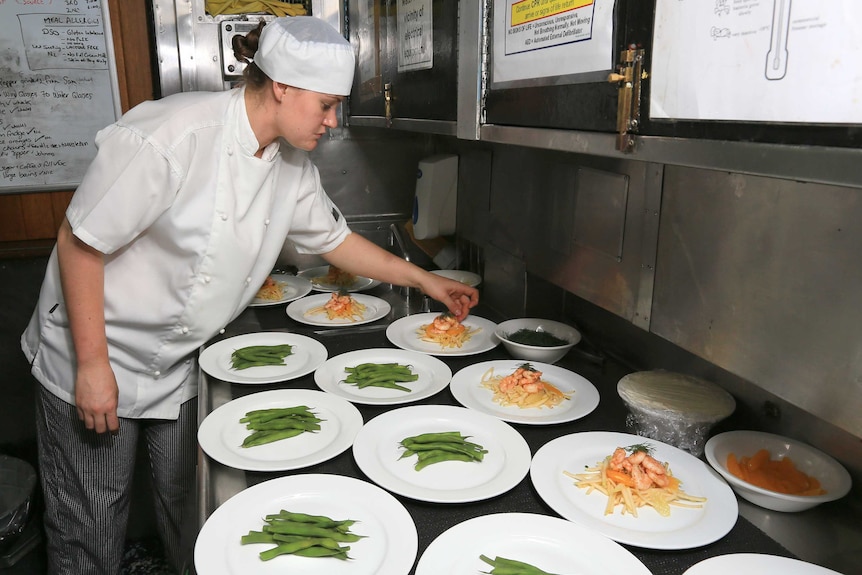 Chef prepares meal aboard HMAS Sydney