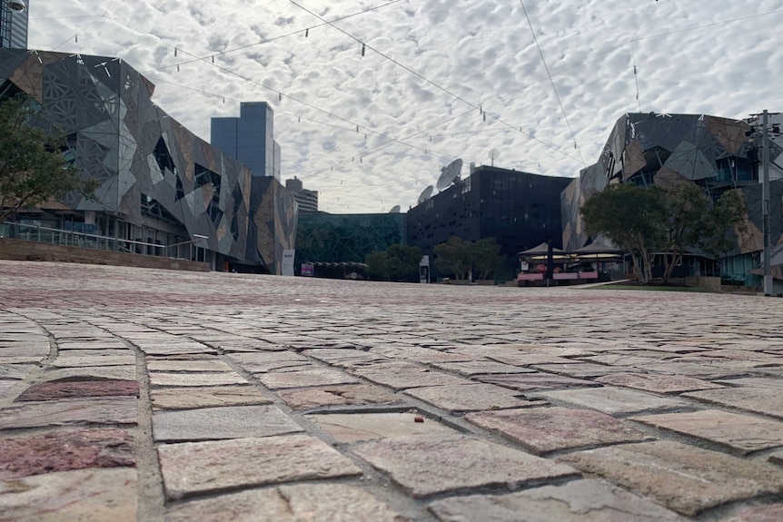 Federation Square with not a single soul in the pedestrian areas.