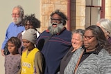 A crowd of people stand out the front of the Kalgoorlie Courthouse after the resolution of a case.
