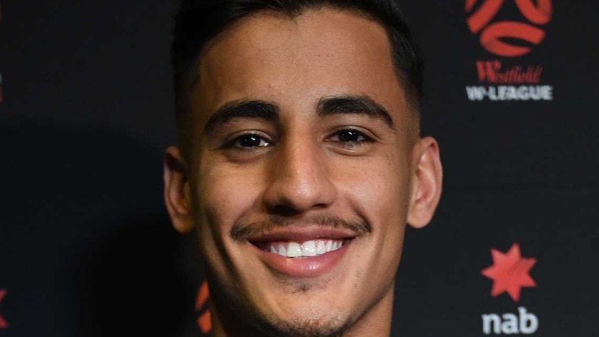 Daniel Arzani holding the Young Footballer of the Year 2018 trophy