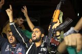 Palestinians in Gaza City celebrate the beginning of truce with Israel.