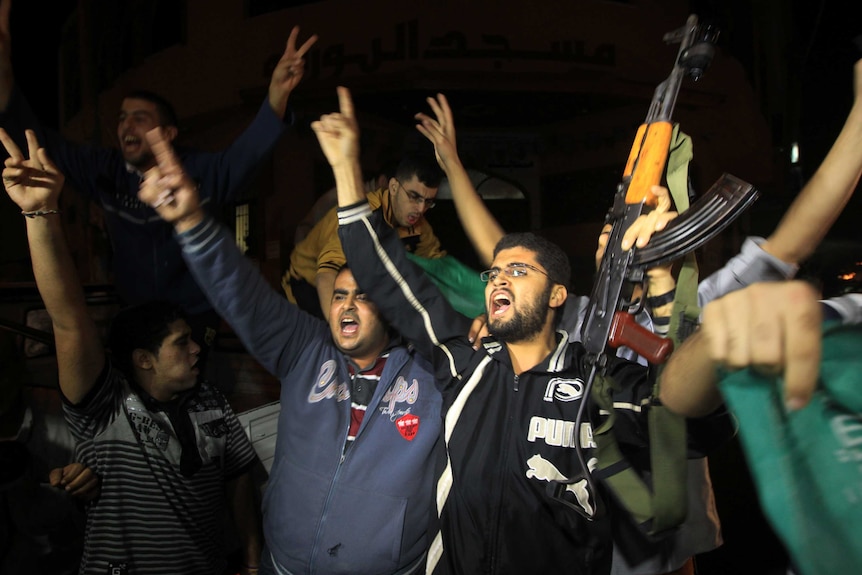 Palestinians in Gaza City celebrate the beginning of truce with Israel.