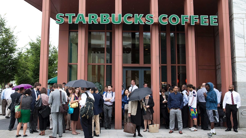 Customers stand outside Starbucks store during Washington Navy Yard shooting