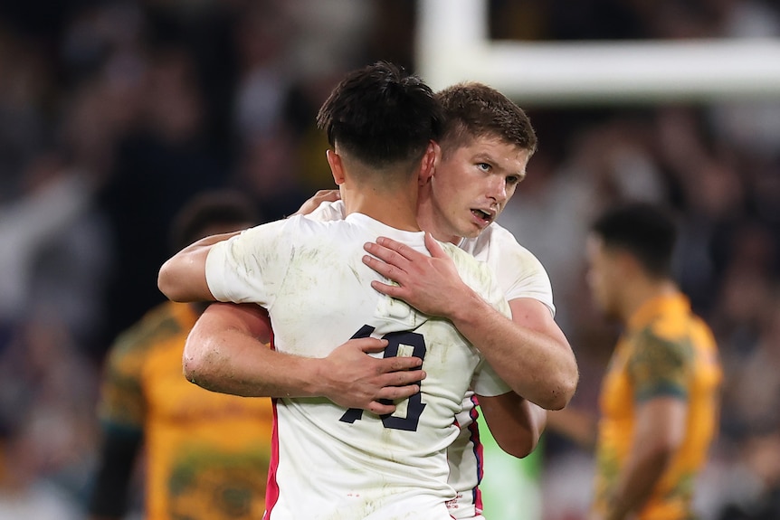 Owen Farrell and Marcus Smith hug