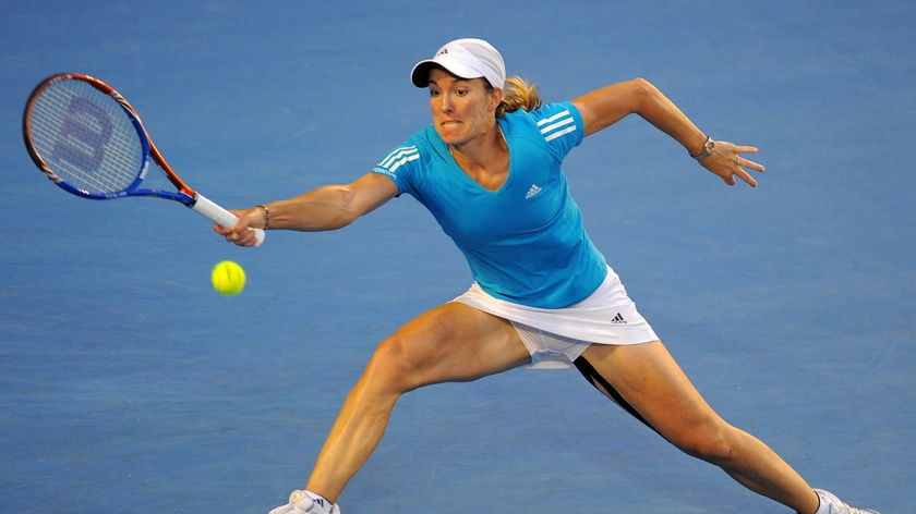 Henin stretches for forehand during Open final