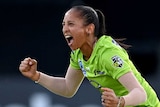 Sydney Thunder's Shabnim Ismail clenches both fists and smiles as she runs away after dismissing Elyse Villani in the WBBL final