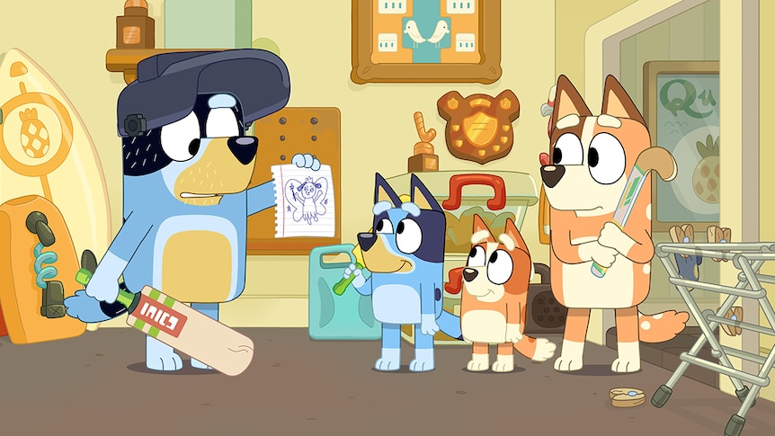 A family of animated blue and brown Blue Heeler dogs with cricket bats and hockey sticks, look at a drawing in a living room.