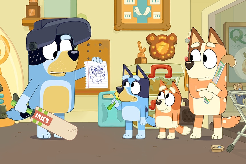 A family of animated blue and brown Blue Heeler dogs with cricket bats and hockey sticks, look at a drawing in a living room.