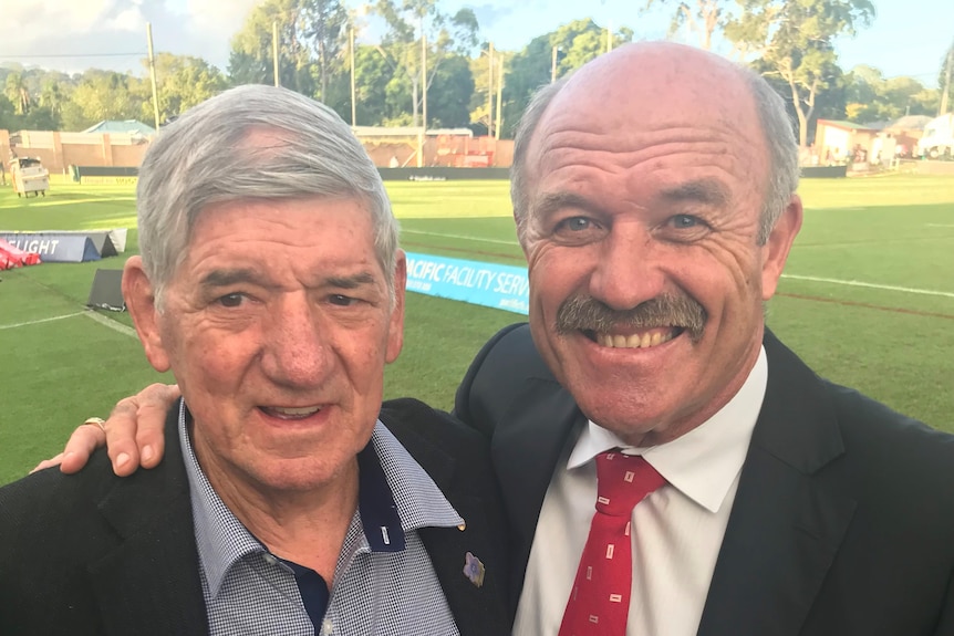 two men at footy oval