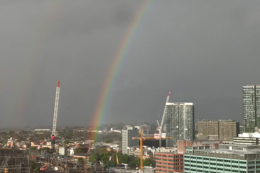 Streaks of colour over urban buildings.