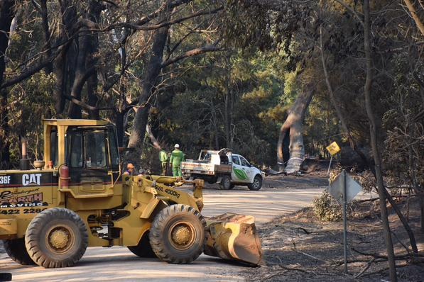 Workers clear fire ground near Lancefield