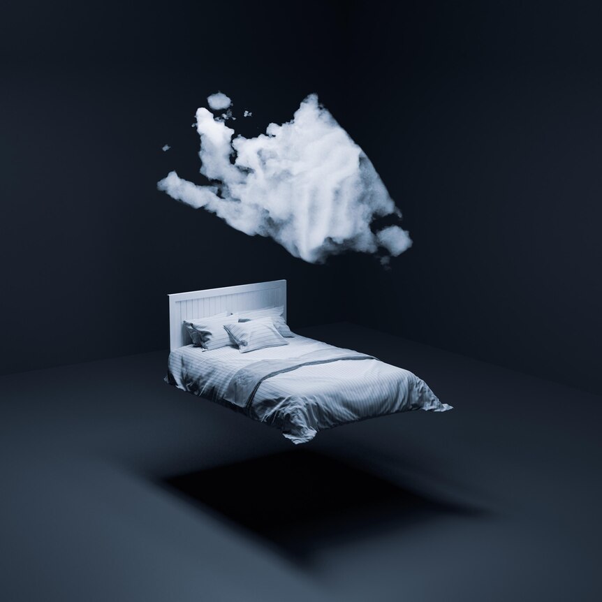 A bed hanging above the ground in a grey room with a cloud forming above it