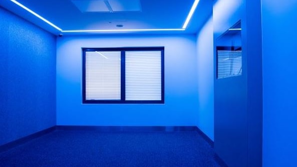 Sensory modulation room with blue lighting.